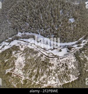 Germany, Thuringia, Ilmenau, Gehren, forest, forest roads, valley, brook, snow, Rennsteig environment, aerial view, top view Stock Photo