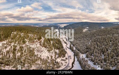 Germany, Thuringia, Gehren, forest, forest roads, valley, brook, snow, Rennsteig environment, aerial view Stock Photo