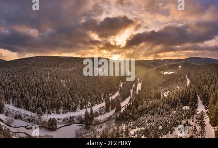 Germany, Thuringia, Gehren, forest, valley, brook, snow, Rennsteig environment, back light, aerial view, panorama Stock Photo