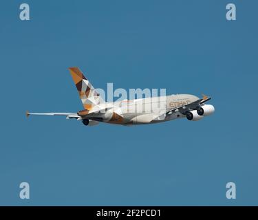 London, Heathrow Airport - April 2019: Etihad A380 taking off from LHR Runway 09R on route to Abu Dhabi on a sunny day. Photographer Abdul Quraishi fr Stock Photo