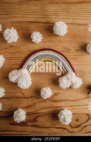 Macrame rainbow with white pompons Stock Photo