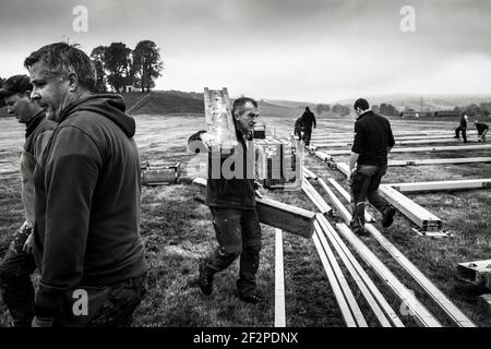 Germany, Bavaria, Antdorf, festival week of the traditional costume association. Men building the marquee. Stock Photo