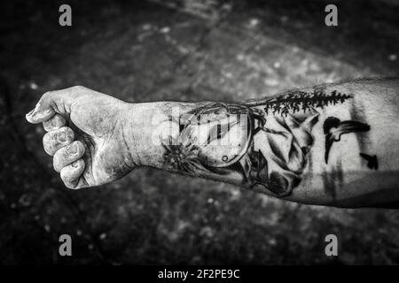 Germany, Bavaria, Antdorf, festival week of the traditional costume association. Man with tatoos on his forearm. Stock Photo