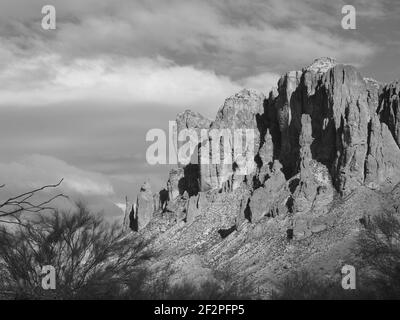 Superstition Mountain in Arizona in black and white and color. Located in the Tonto National Forest, it is a spectacular sight and place for hiking. Stock Photo