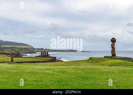 Ahu Tahai with Moai statues and Hanga Roa city with harbor, Easter Island (Rapa Nui), Chile. Stock Photo