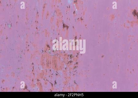 rusty metal pink wall with fallen off paint, rusty background Stock Photo