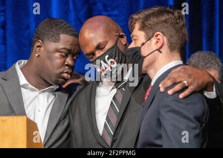 Minneapolis, Minnesota, USA. 12th Mar, 2021. BRANDON WILLIAMS, left, the nephew of George Floyd and PHILONISE FLOYD, middle, the brother of George Floyd interact at a press conference after the Minneapolis City Council approved a 27 million dollar civil lawsuit settlement with the Floyd family. Credit: Chris Juhn/ZUMA Wire/Alamy Live News Stock Photo