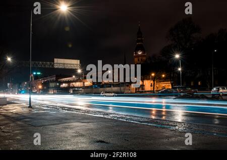 Long exposure photo at night. Light trails on the road. City street. Stock Photo