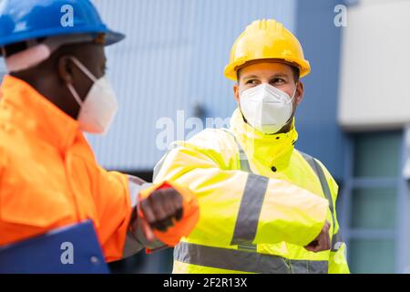 Construction Industry People Teamwork Elbow Bump Greeting Stock Photo