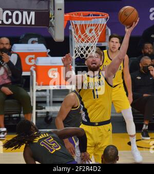 Los Angeles, United States. 12th Mar, 2021. Indiana Pacers' power forward Domantas Sabonis scores over Los Angeles Lakers' center Montreal Harrell during the fourth quarter at Staples Center in Los Angeles on Friday, March 12, 2021. The Lakers defeated the Pacers 105-100. Photo by Jim Ruymen/UPI Credit: UPI/Alamy Live News Stock Photo