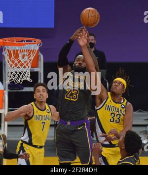 Los Angeles, United States. 12th Mar, 2021. Los Angeles Lakers' forward LeBron James blocks the shot of Indiana Pacers' center Myles Turner during the fourth quarter at Staples Center in Los Angeles on Friday, March 12, 2021. The Lakers defeated the Pacers 105-100. Photo by Jim Ruymen/UPI Credit: UPI/Alamy Live News Stock Photo