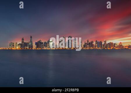 The skyline of Doha, Qatar after sunset Stock Photo