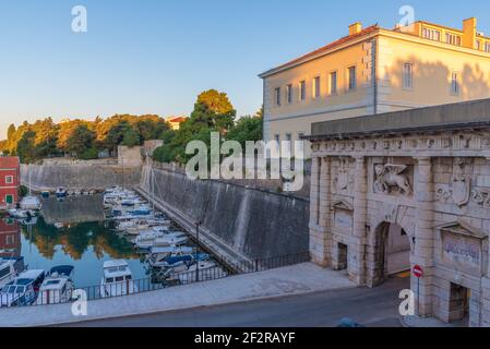 Sunrise view of a marina situated next to the land gate in Croatian town Zadar Stock Photo