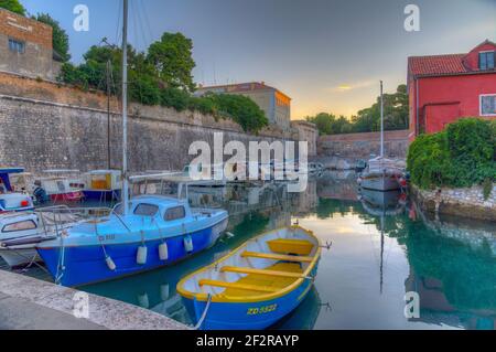 Sunrise view of a marina situated next to the land gate in Croatian town Zadar Stock Photo