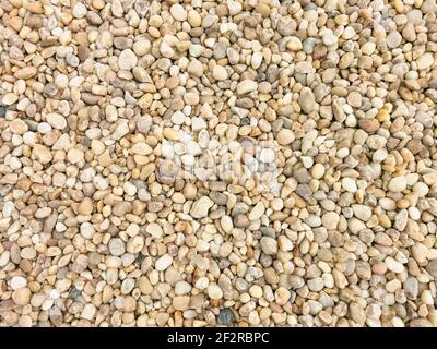View of textures of various cobble stones, yellowish colors, used for roofing of buildings... Stock Photo