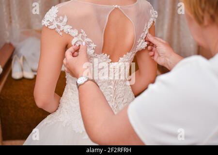 The bride is being prepared for marriage.  Stock Photo