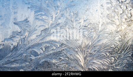 frost pattern on a window glass in the winter (as an abstract winter background) Stock Photo
