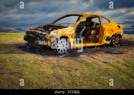 Rusty burned out car Stock Photo