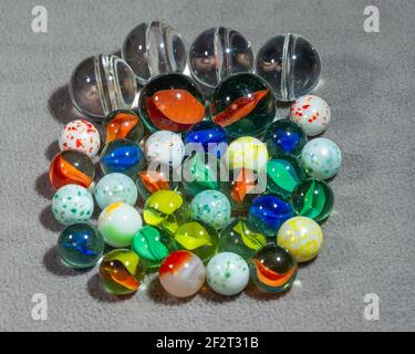 collection of various types and sizes of marbles grouped together Stock ...