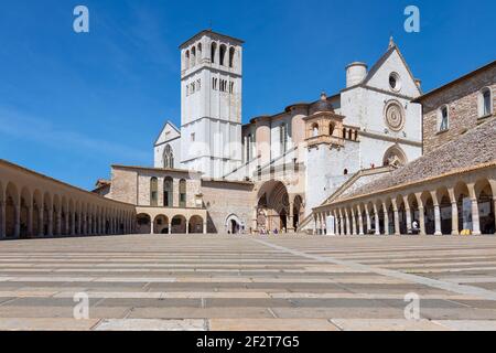 Famous Papal Basilica of St. Francis of Assisi (Basilica Papale di San Francesco) with lower square. Assisi, Umbria, Italy Stock Photo