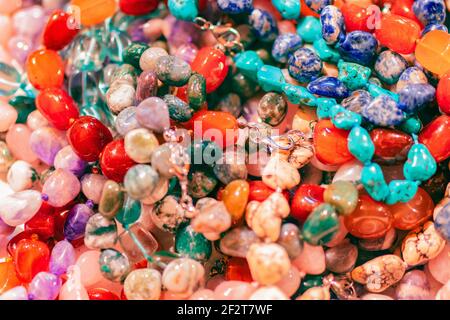 Beautiful background with plenty of colorful stone beads. Collection of colorful beads. Gemstone beads. Stock Photo