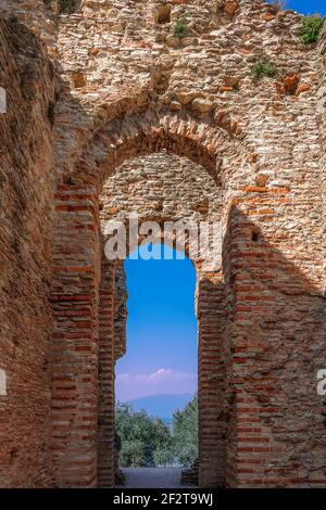 Sirmione, Italy - March 25, 2019: Arches of an ancient roman villa Catullo Caves (Grotte di Catullo) in Sirmione town, Lake Garda, Italy Stock Photo