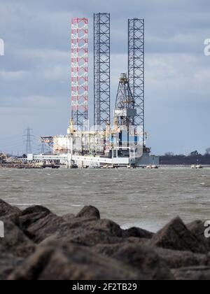 Sheerness, Kent, UK. 13th March, 2021. UK Weather: a windy and cold morning with some sunny spells in Sheerness, Kent. View towards 'Ran' drill rig. Credit: James Bell/Alamy Live News Stock Photo