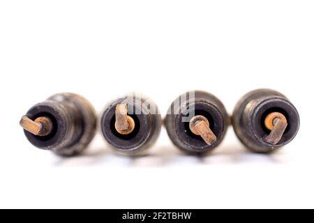 closeup shot of used spark plug on white background. Stock Photo
