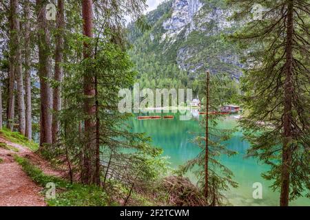 View of the chapel and boat house on the famous Braies Lake Stock Photo