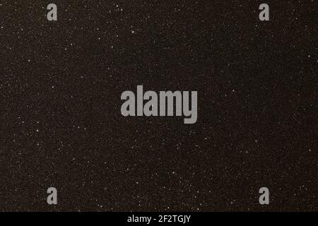 Black texture with micro-relief and glitter. Black glitter texture Stock Photo