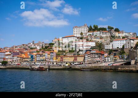 The riverside of the historical northern Portuguese city of Porto, river, with its colourful houses overlooking the Tejo river - Portugal. Stock Photo