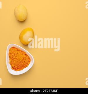 Easter eggs painted with natural dye on an orange background Stock Photo