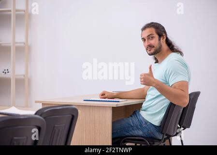 Young student in the classroom during pandemic Stock Photo