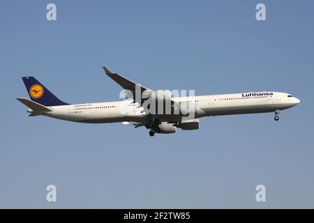 German Lufthansa Airbus A340-600 with registration D-AIHS on short final for runway 07R of Frankfurt Airport. Stock Photo