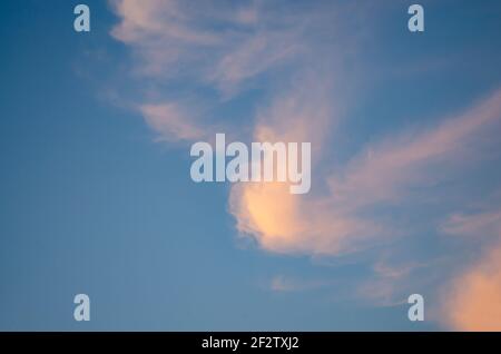 A single cloud of strange shape in the sky Stock Photo