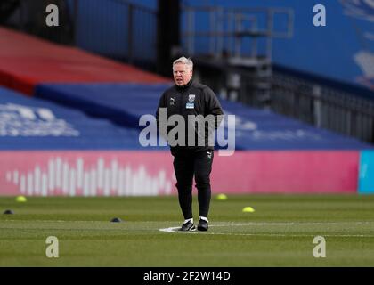 Selhurst Park, London, UK. 13th Mar, 2021. English Premier League Football, Crystal Palace versus West Bromwich Albion; West Bromwich Albion Assistant Coach Sammy Lee observing the West Bromwich Albion players warming up Credit: Action Plus Sports/Alamy Live News Credit: Action Plus Sports Images/Alamy Live News