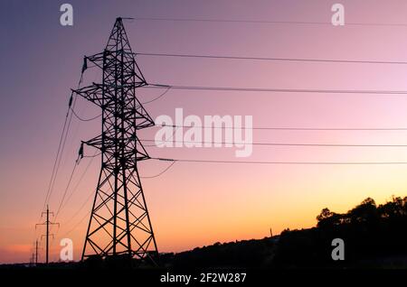 high voltage post. High-voltage tower sky background. Stock Photo