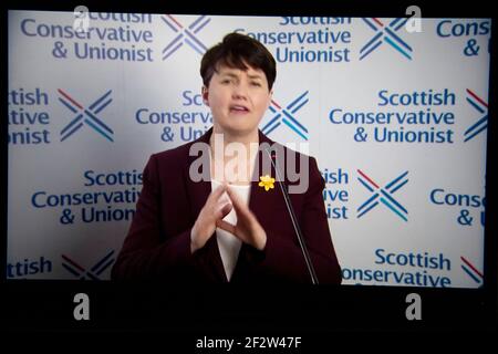 Edinburgh, Scotland, UK. 13th Mar, 2021. Pictured: Ruth Davidson MSP, Scottish Conservative Holyrood Leader, seen speaking at Scottish Conservatives National Conference (SCC21). Ruth said: “Scotland can't afford another five years of this divisive, distracting, destructive SNP obsession. “In the midst of a global pandemic, when the only priority should be pulling together to defeat it, to get the country back on its feet, the SNP's priority is to divide us all over again. Credit: Colin Fisher/Alamy Live News Stock Photo