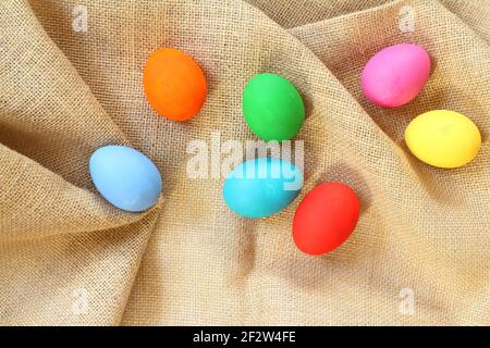 The Colorful easter eggs on sack background. Stock Photo