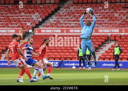 Nottingham, UK. 13th Mar, 2021. Brice Samba #30 of Nottingham Forest makes easy work of Andy Yiadom #17 of Reading's cross in Nottingham, UK on 3/13/2021. (Photo by Mark Cosgrove/News Images/Sipa USA) Credit: Sipa USA/Alamy Live News Stock Photo