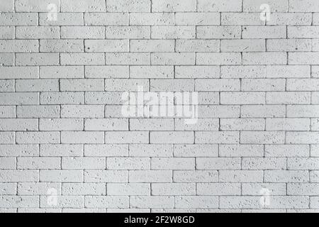 Loft styled white brick wall. Surface white wall of stone wall gray tones for use as background. Brick room, interior texture, wall background. Texture of whitened masonry Stock Photo