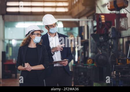 Engineer with digital tablet supervising autonomous producton process Stock Photo