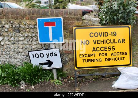 Covid 19, No Vehicular Access, Except For Access, Turning Difficult. Covid road sign advising of potential risk as turning is difficult. Stock Photo