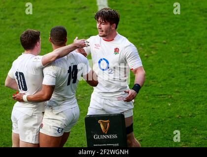 Twickenham, London, UK. 13th Mar, 2021. International Rugby, Six Nations, England versus France; Anthony Watson of England scores down the line for 7-7 in the 10th minute and George Ford of England and Tom Curry of England congratulate him Credit: Action Plus Sports/Alamy Live News Stock Photo
