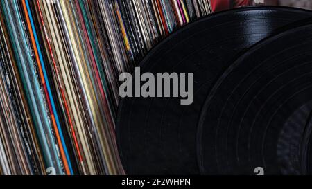 two records lean against a pile of records Stock Photo