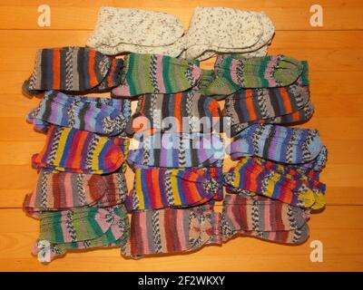 Hand-knitted socks in many colors Stock Photo