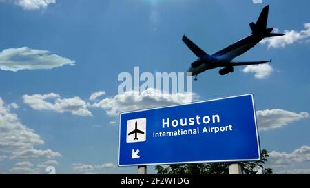 Airplane silhouette landing in Houston, Texas, USA. City arrival with international airport direction signboard and blue sky in background. Travel, tr Stock Photo