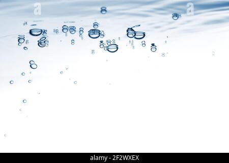 Water blue nature background. Bubbles on the clear water liquid surface Stock Photo