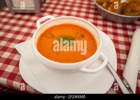 A bowl of gazpacho on a restaurant table in Valencia. Gazpacho is a fresh tomato soup served as an appetizer Stock Photo