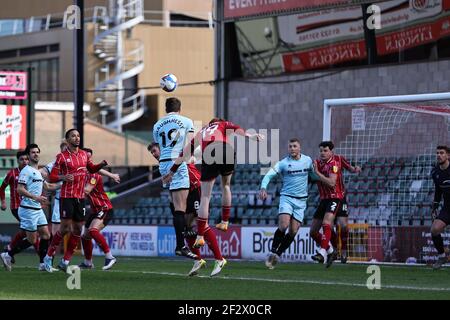 LINCOLN, UK. MARCH 13TH: Conor Shaughnessy of Rochdale heads the ball in the Lincoln area during the Sky Bet League 1 match between Lincoln City and Rochdale at LNER Stadium, Lincoln on Saturday 13th March 2021. (Credit: James Holyoak | MI News) Credit: MI News & Sport /Alamy Live News Stock Photo